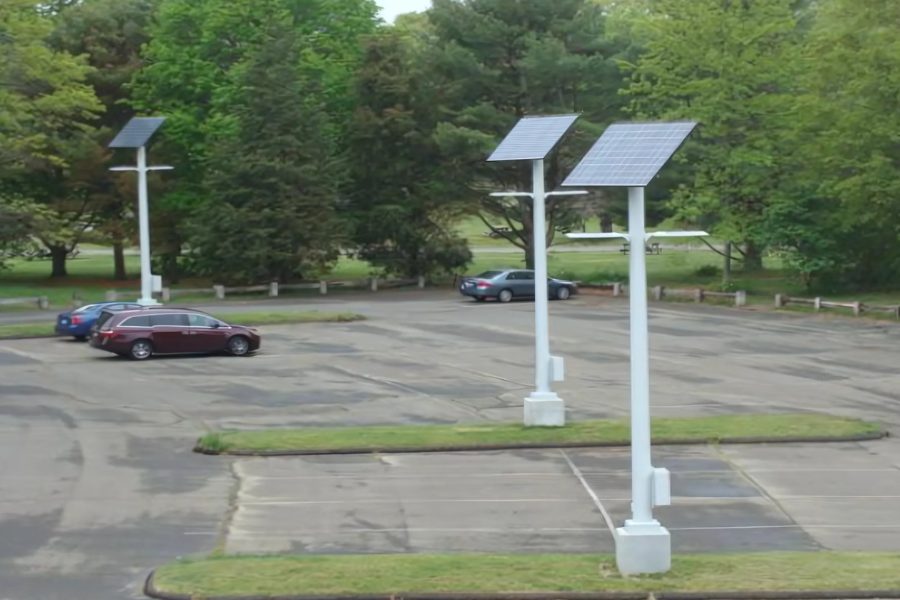 Off-grid solar light poles in a Hammonasset Beach State Park parking lot