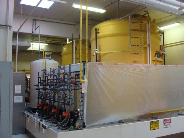 Storage tank and chemical feed pump skid inside the containment area